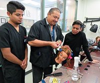 Gilbert Ramirez teaching students