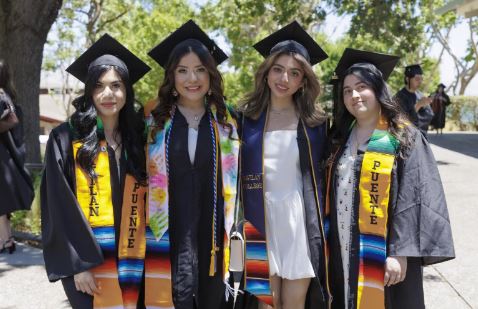 Graduates celebrate their achievement following the 2025 commencement ceremony. (Photo by Chris Mora)
